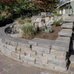 retaining wall with plants and stones