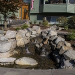 view of natural stone water feature