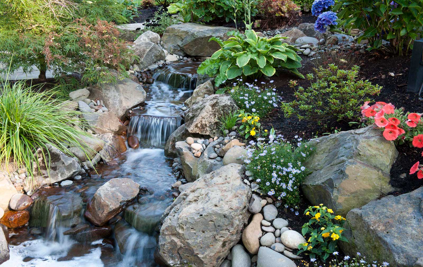 waterfall will natural stones and plants